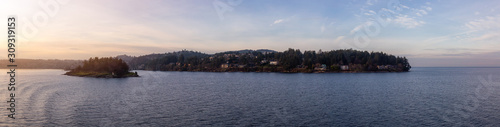 Nanaimo, Vancouver Island, British Columbia, Canada. Panoramic View of Residential Homes in the Modern City by the Ocean during a colorful sunset. © edb3_16