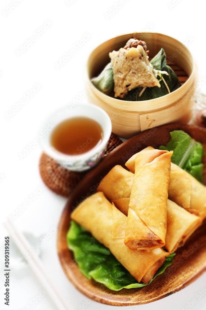 Chinese dumpling, meat and sticky rice wrapped zongzi in bamboo basket Chinese dumpling, meat and sticky rice wrapped zongzi in bamboo basket
