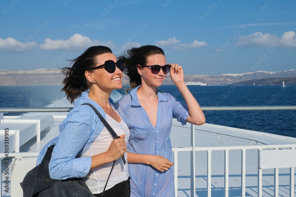 Two traveling women, mother and teenage daughter in luxury travel Mediterranean