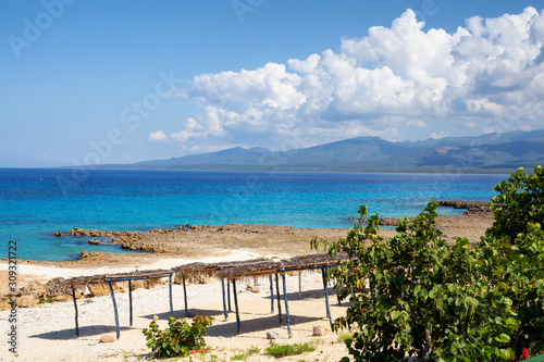 Beautiful View of the Ocean Shore at the Caribbean Sea during a sunny summer day. Taken in Playa Ancon, near Trinidad, Cuba.