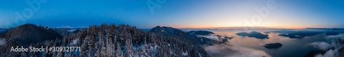 Aerial Panoramic View of Canadian Mountain Landscape on the Pacific Ocean Coast during a colorful sunset. Taken in Howe Sound near Vancouver, British Columbia, Canada.