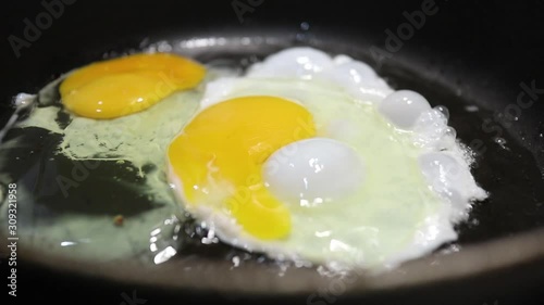 fried egg cooking for breakfast photo