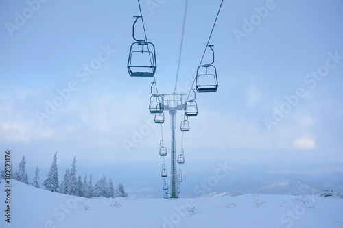 Funicular for tourists, skiers and snowboarders. lift to transport people in the mountains. the cable car on the background of blue mountains. funicular in the mountains