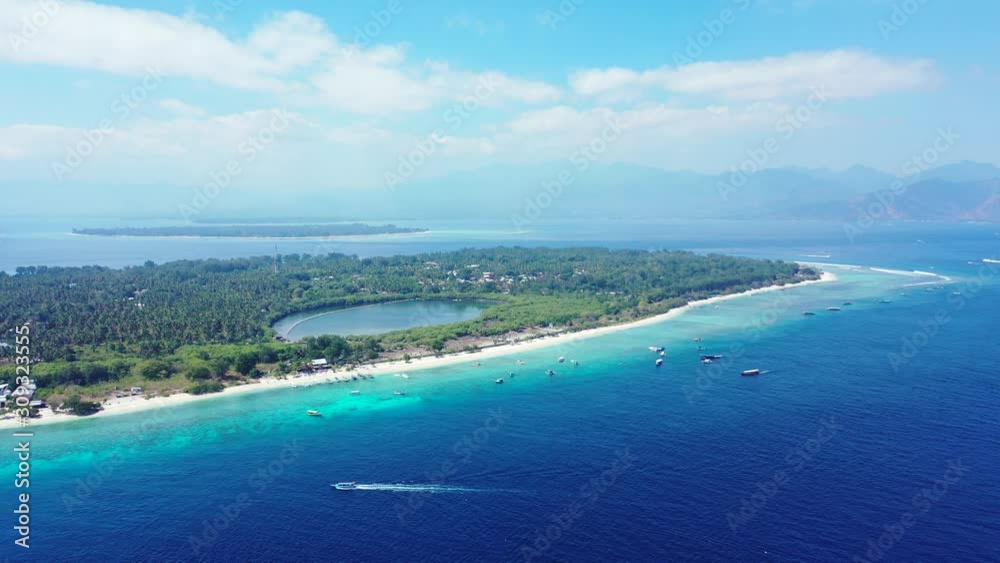 Aerial panorama of the small islands in the tropical ocean, saltwater natural pool in the forest of palm trees, Indonesia Aerial panorama of the small islands in the tropical ocean, saltwater natural pool in the forest of palm trees, Indonesia