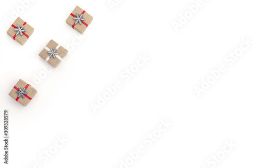 Flat christmas composition on white background with holiday boxes decorated with red and white satin ribbon and snowflake. Concept christmas, minimalism, holiday, sale