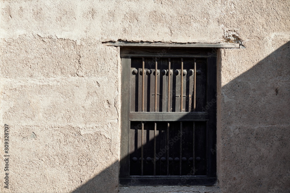 Obraz premium old window with shutters in Fujairah castle