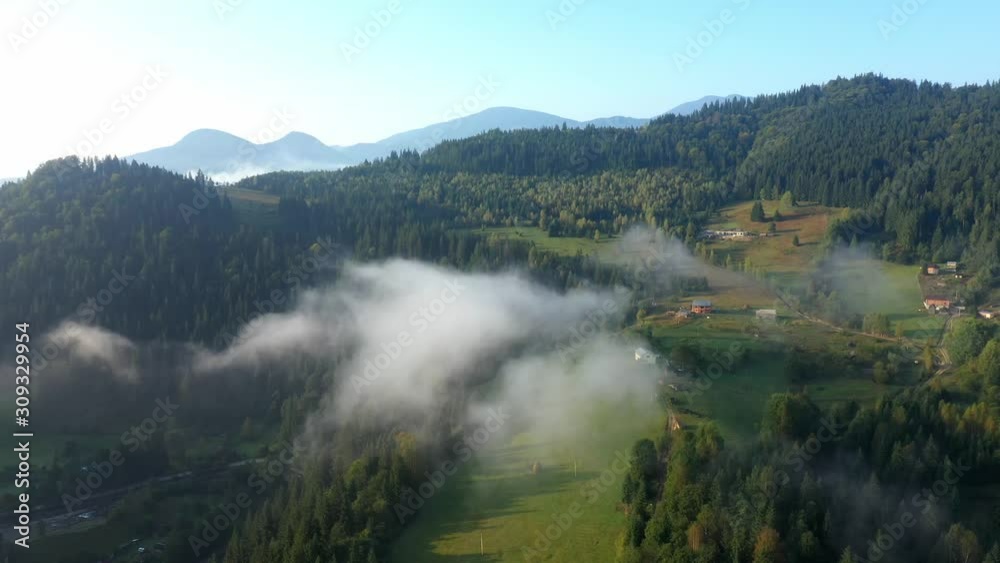 Flying through the clouds above mountain tops. High peaks wonderful morning sunrise natural Landscape Flying through the clouds above mountain tops. High peaks wonderful morning sunrise natural Landscape