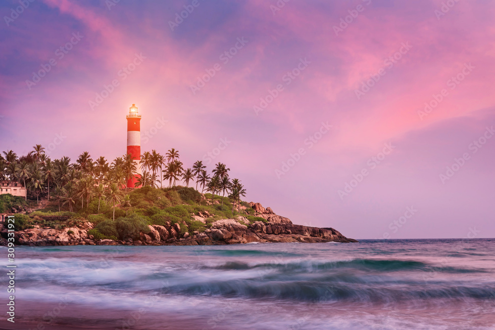 Lighthouse on the cliff in Kovalam Beach