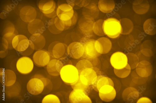 Bokeh golden light and blackish brown background, blurred background. 