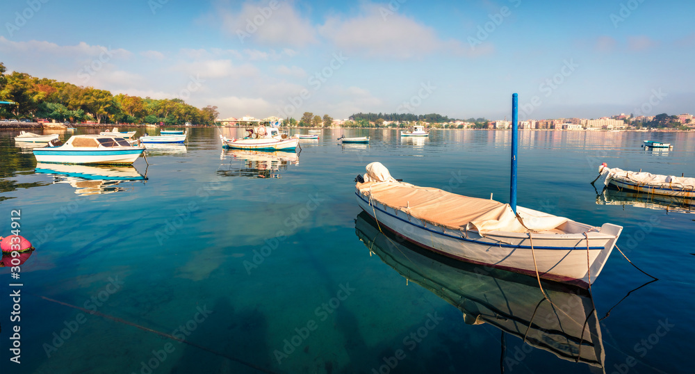Bright morning view of old Kerkira port, capital of Corfu island, Greece, Europe. Splendid summer seascape of Ionian sea. Traveling concept background.