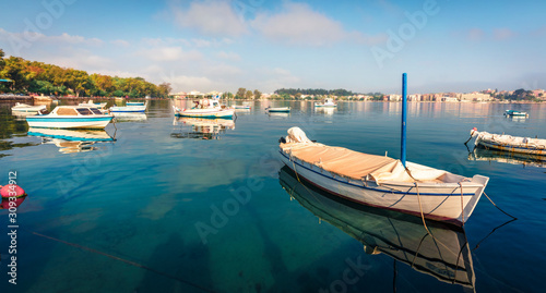 Bright morning view of old Kerkira port  capital of Corfu island  Greece  Europe. Splendid summer seascape of Ionian sea. Traveling concept background.
