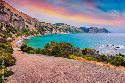 Fototapeta Naklejka Na Ścianę i Meble -  Incredible summer sunrise on Kanoula beach. Captivating morning seascape of Ionian Sea. Unbelievable outdoor scene of Corfu island, Greece, Europe. Beauty of nature concept background.