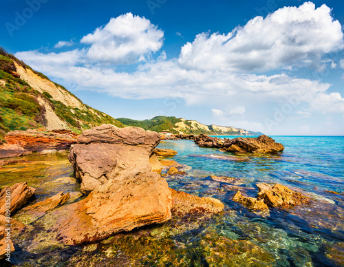 Calm summer view of small port in Gardenos village. Wonderful morning seascape of Ionian Sea. Amazing landscape of Corfu island, Greece, Europe. Traveling concept background.