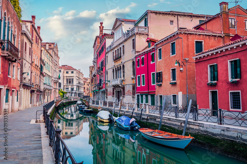 Colorful summer cityscape ofVennice with famous water canal and colorful houses. Spectacular morning scene of Italy, Europe. Traveling concept background.