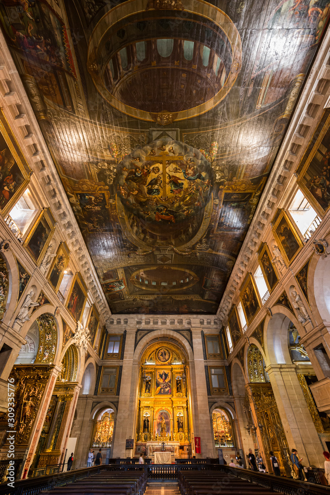 Ornate interior of the Roman Catholic church Igreja de Sao Roque (Church of Saint Roch) looking towards the main altar. Lisbon, Portugal.