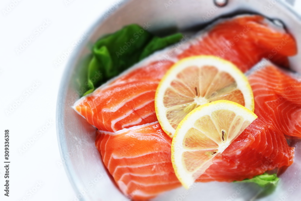 Freshness salmon and lemon on stainless steel pan Freshness salmon and lemon on stainless steel pan