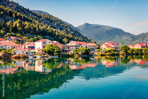 Typical Croatian countreside view with calm sea and sunny morning. Colorful summer seascape of Adriatic sea, Slano willage location, Croatia, Europe. Beautiful world of Mediterranean countries.