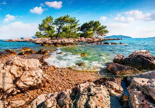 Adriatic is one of the best places to relax, and even in windy weather you can swim in the warm sea waters. Small islet on the Adriatic sea, Sjekirica beach, Croatia, Europe.