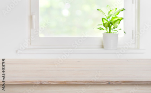 Natural texture wooden tabletop with blurred window for product display