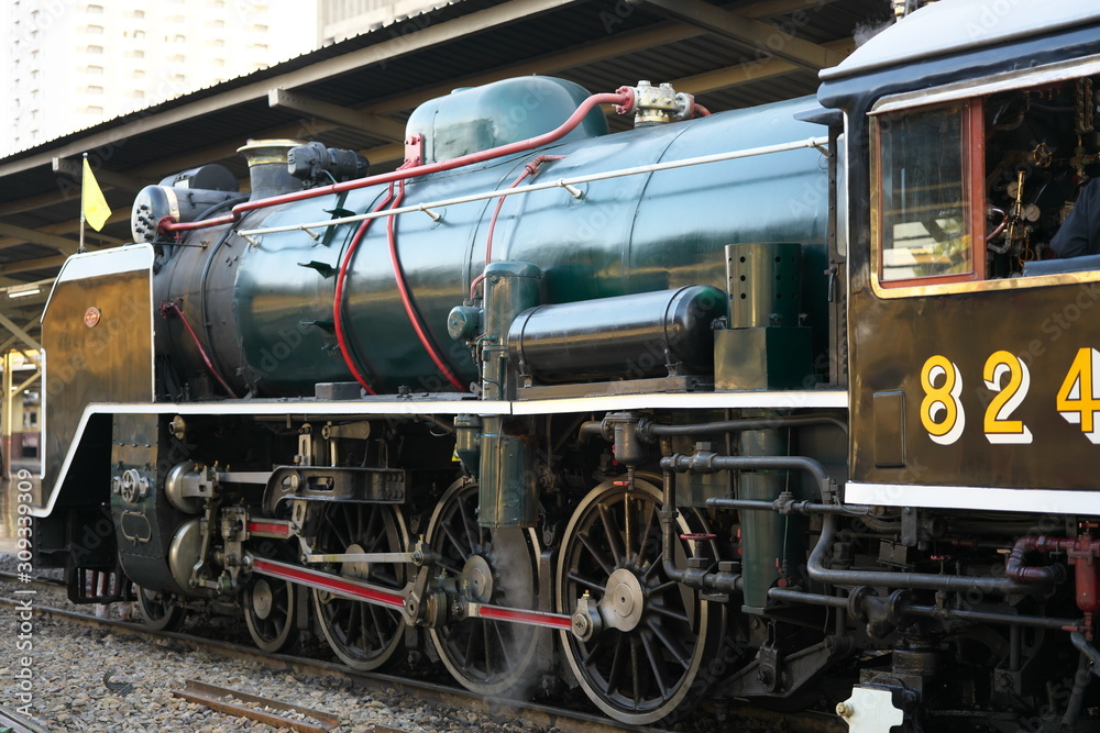Naklejka premium Bangkok,Thailand-December 5, 2019: Double-headed steam locomotive train at Hua Lamphong station in Bangkok, Thailand