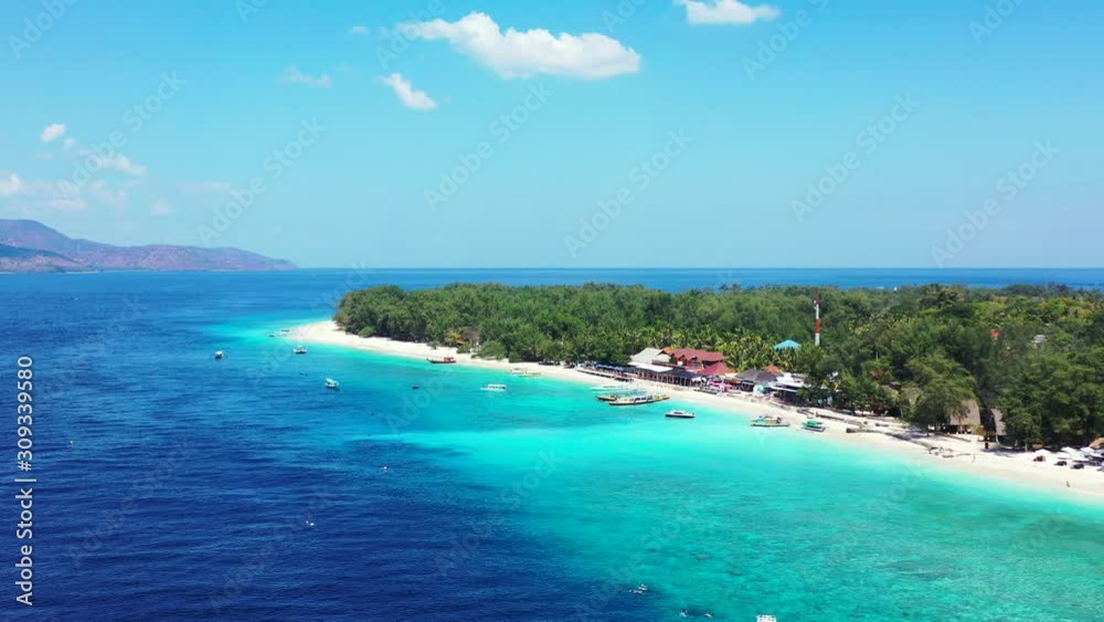 Tropical islands with luxury bungalows, boats floating in the crystal clear aquamarine sea waters. aerial panorama with copy space Tropical islands with luxury bungalows, boats floating in the crystal clear aquamarine sea waters. aerial panorama with copy space
