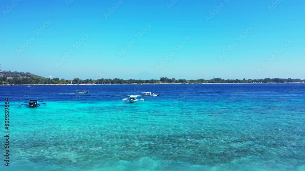 beautiful philippine sea with boats and small tropical island on the horizon beautiful philippine sea with boats and small tropical island on the horizon