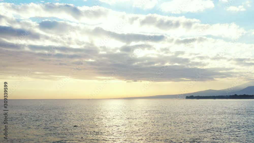 Stunning View Of calm Ocean, with dramatic sky during the sunrise Stunning View Of calm Ocean, with dramatic sky during the sunrise
