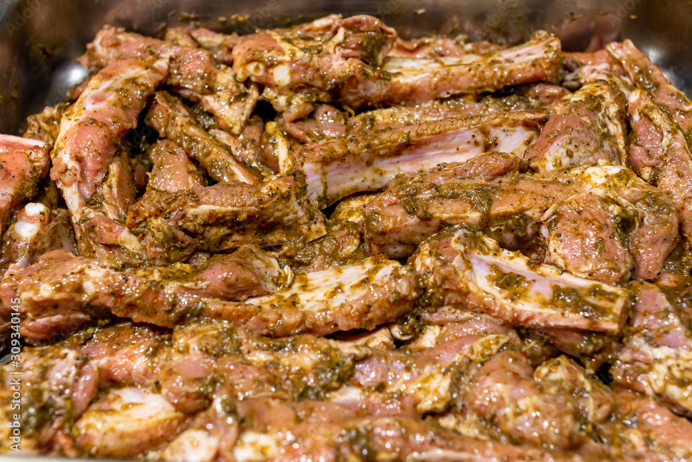 Raw pork ribs marinated in jamaican jerk seasoning Raw pork ribs marinated in jamaican jerk seasoning