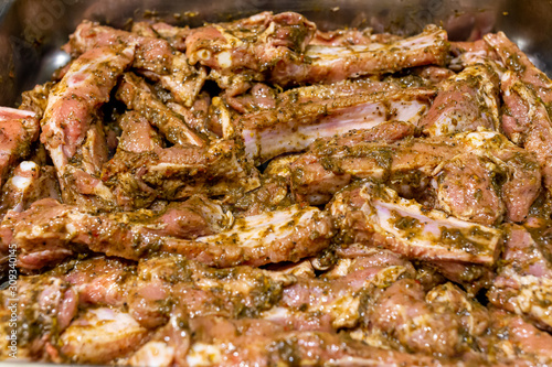 Raw pork ribs marinated in jamaican jerk seasoning