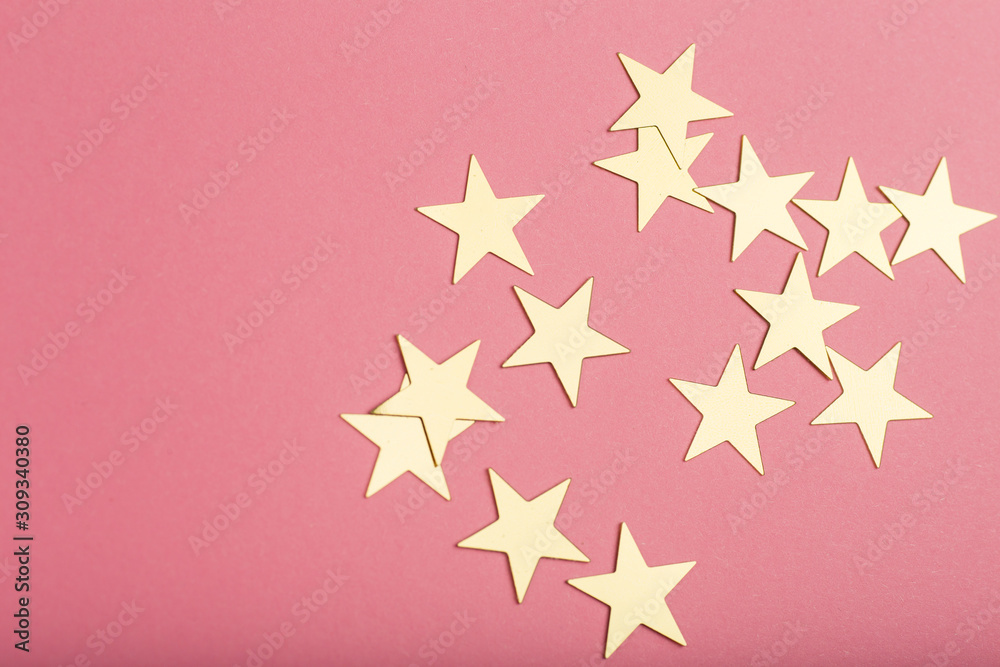pink background with gold asterisks