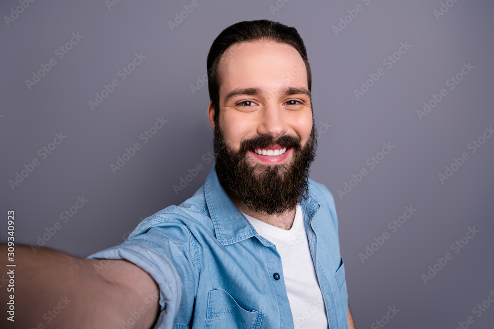 Close up photo of attractive content guy make selfie on spring time vacation journey wear good looking outfit isolated over grey color background Close up photo of attractive content guy make selfie on spring time vacation journey wear good looking outfit isolated over grey color background