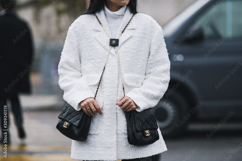 Paris, France - March 05, 2019: Street style outfit - Woman wearing Chanel  purse after a fashion show during Paris Fashion Week - PFWFW19 Stock Photo  - Alamy