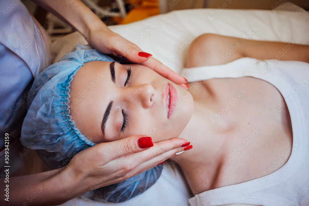 doctor cosmetologist doing facial massage girl spa doctor cosmetologist doing facial massage girl spa