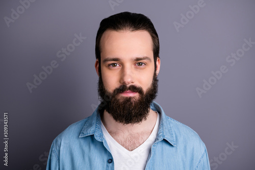 Closeup photo of amazing macho guy serious perfect appearance neat long hairdo bristle young promoted boss chief wear casual denim outfit isolated grey color background