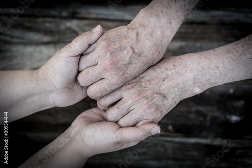 Young and old hands love and care