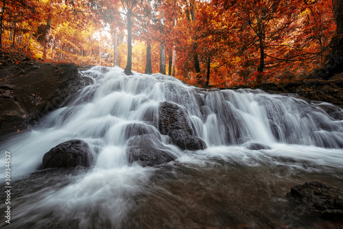 Fototapeta Naklejka Na Ścianę i Meble -  Beautiful waterfall in tropical forest at National Park.