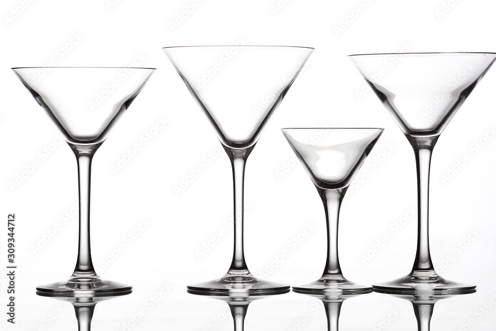 empty wine glasses of different shapes on a white background