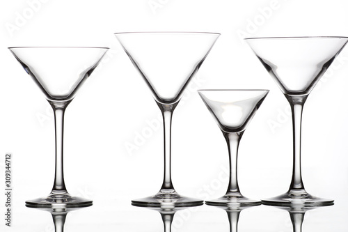 empty wine glasses of different shapes on a white background