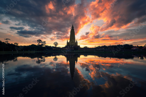 Beautiful nature with sunrise reflection on water at Wat Bang Thong ,famous temple in Krabi, Thailand.
