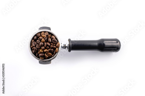 Brown roasted coffee beans on the potta filter isolated on white background. photo