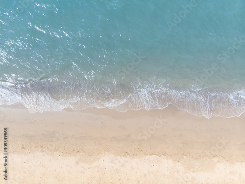 Blue sea and white sand beach in summer landscape for web advertisment and poster background.Aerial view of seashore coastline by drone © MemoryMan