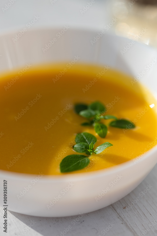 pumpkin soup with herbs. vegan food. 