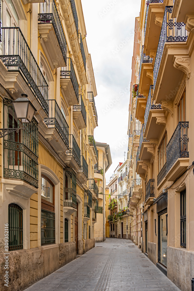 One of the beautiful side streets of Carrer dels Cavallers in Valencia, Spain