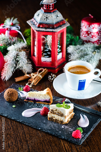 Obraz na płótnie Cup of coffee with christmas decorations on dark wooden table. w salonie