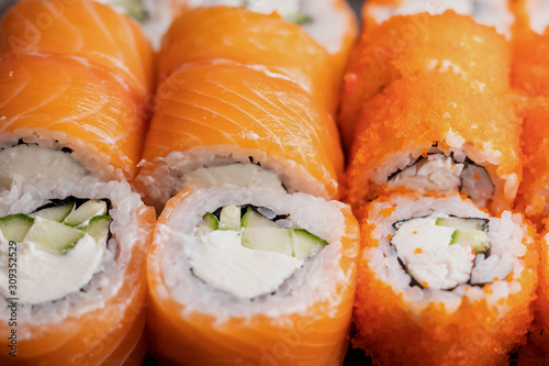 Detail of a california maki and philadelphia rolls in bento box