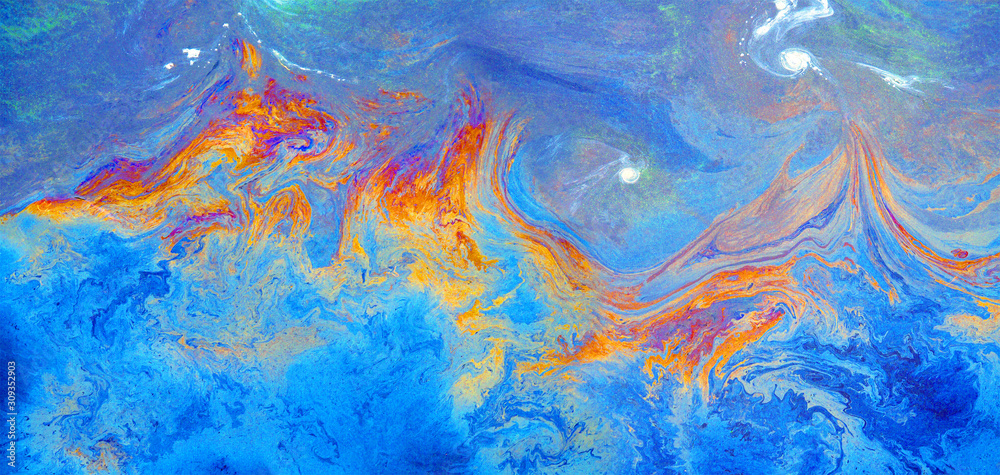 Rainbow colored oil on water. Gasoline stains, panoramic view. Ecological problem. Abstract background of oil on water. Slick industry oil fuel spilling water pollution