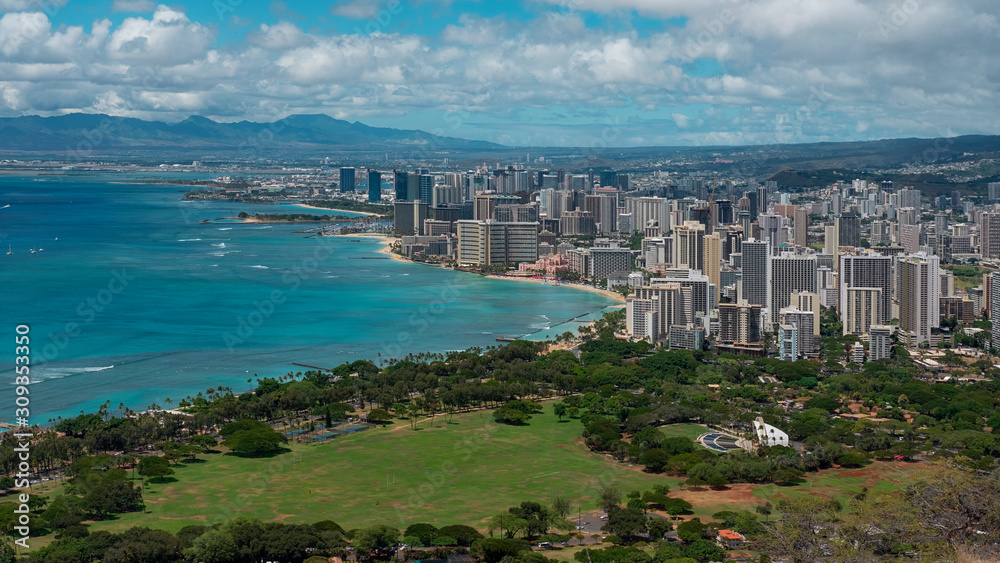 Panoramic vistas from Diamond Head view point towards Waikiki Beach, beachfront lined with towering hotels and holiday accommodation, exquisite restaurants and shops, Honolulu, Oahu Island, Hawaii, US