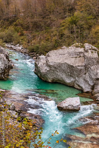 Rocky banks of emerald Soca river in autumn season in Slovenia © Dmitrii
