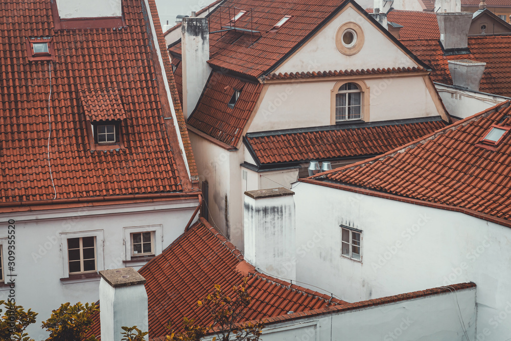 Traditional white houses with red roof in Prague historical center