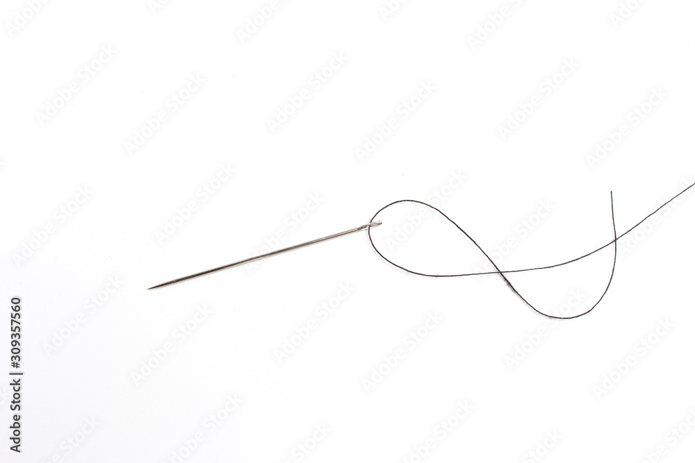 Needle, thread, button and spool of thread